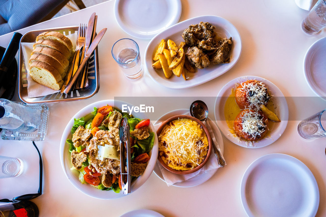 high angle view of food served in plates on table