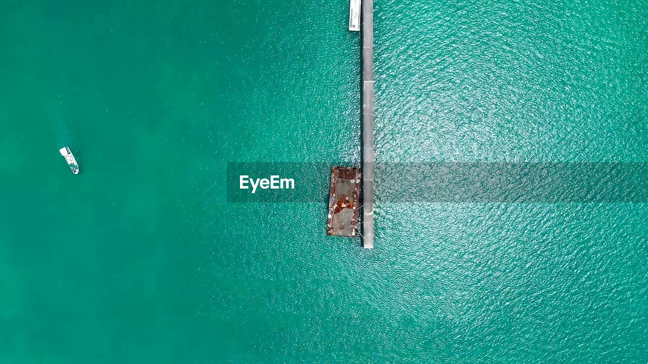 Aerial view of metallic structure on sea