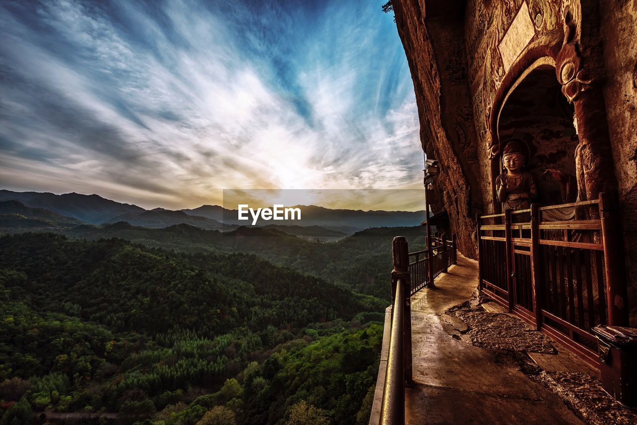 Buddha sculpture at maijishan grottoes during sunset