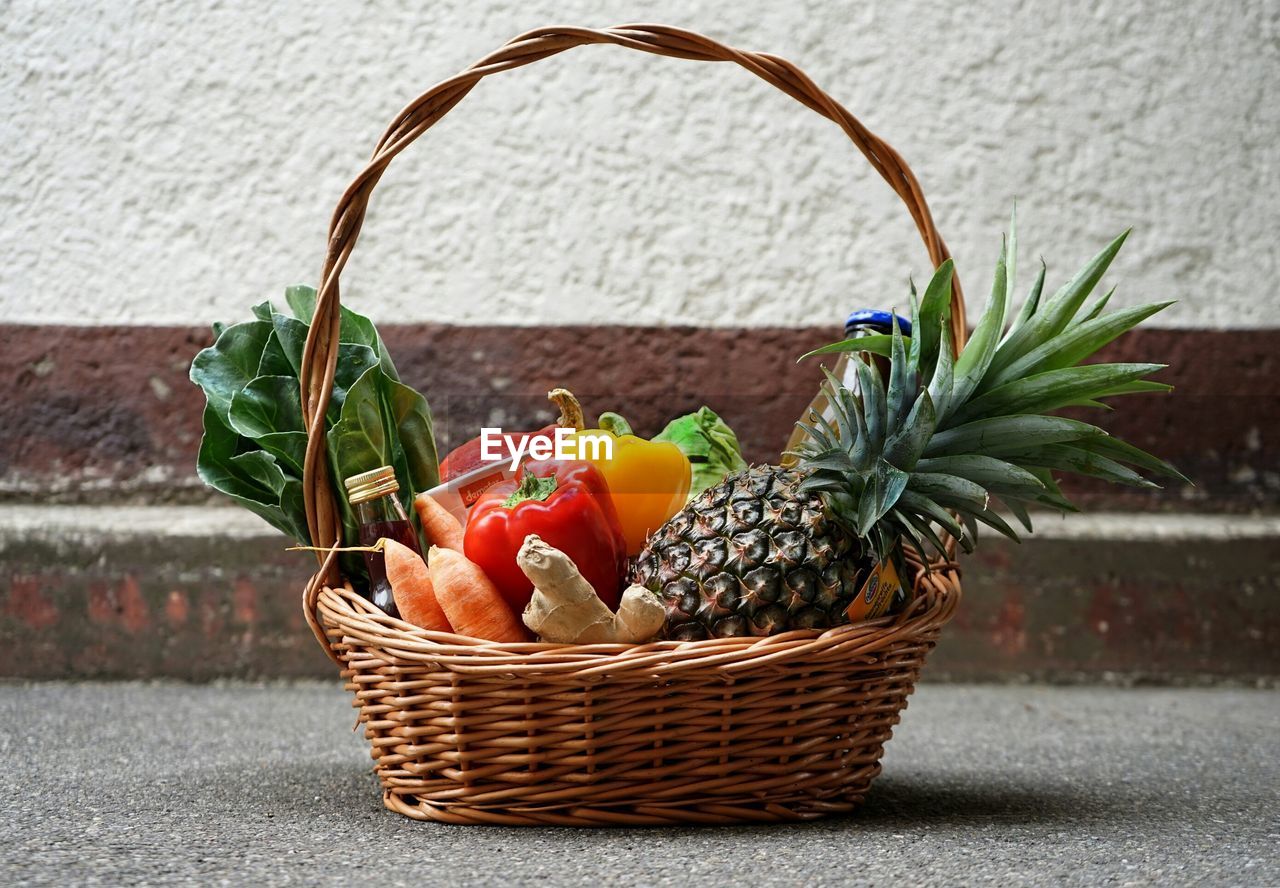 Close-up of vegetables and fruits in wicker basket