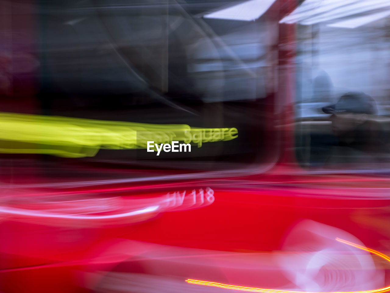 Blurred motion of car on illuminated road