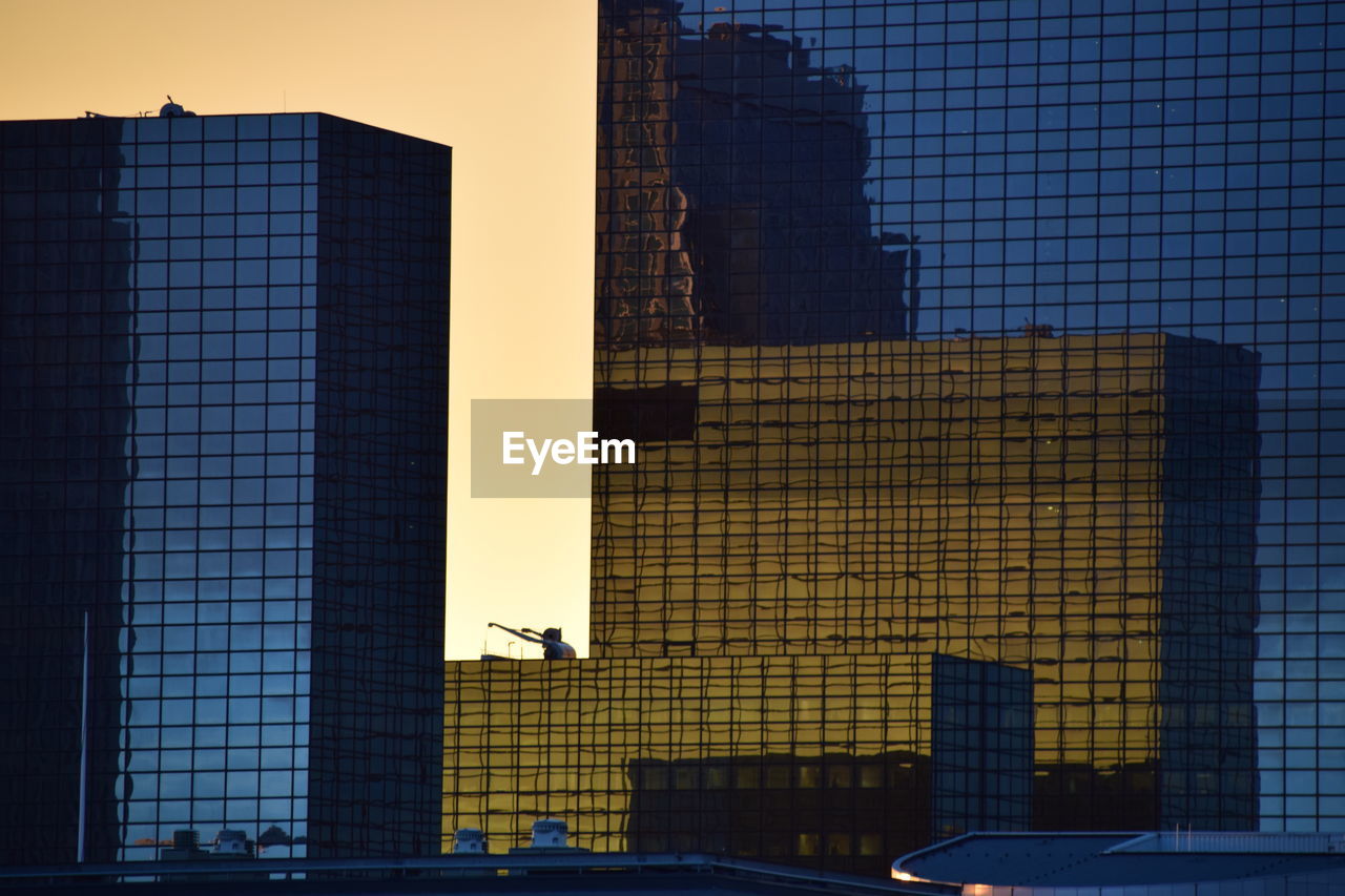 View of office buildings against clear sky