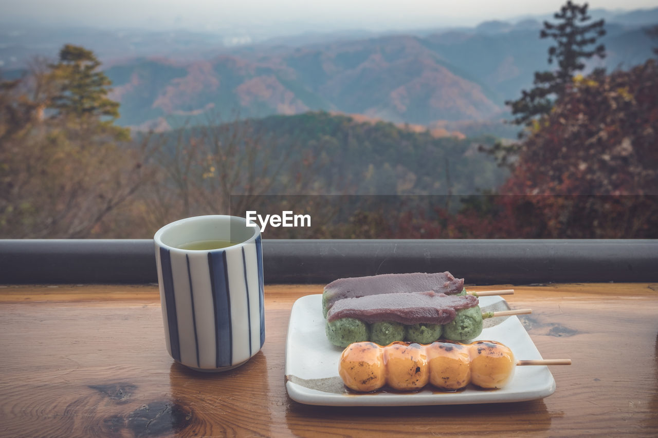 HIGH ANGLE VIEW OF BREAKFAST AND COFFEE SERVED ON TABLE