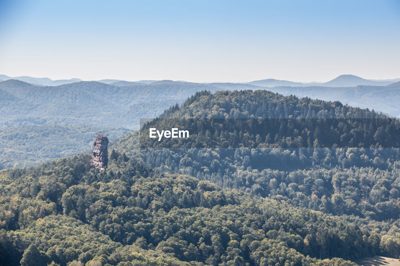 High angle view of trees and mountains against sky