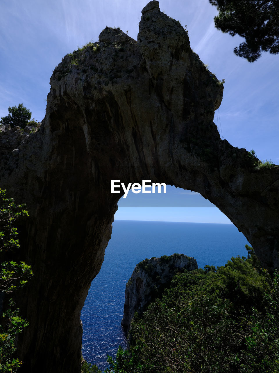 rock, sky, arch, nature, natural arch, rock formation, beauty in nature, land, scenics - nature, plant, tree, water, travel destinations, environment, landscape, tranquility, no people, cloud, architecture, travel, outdoor pursuit, non-urban scene, sea, cave, blue, geology, outdoors, coast, clear sky, nature reserve, idyllic, physical geography, forest, cliff, tourism, terrain, mountain, pinaceae, activity, tranquil scene, day, eroded, sunny, reflection, accidents and disasters, atmospheric mood, limestone, hole, coniferous tree, pine tree, animal wildlife, beach, silhouette, history, pine woodland, sunlight, formation