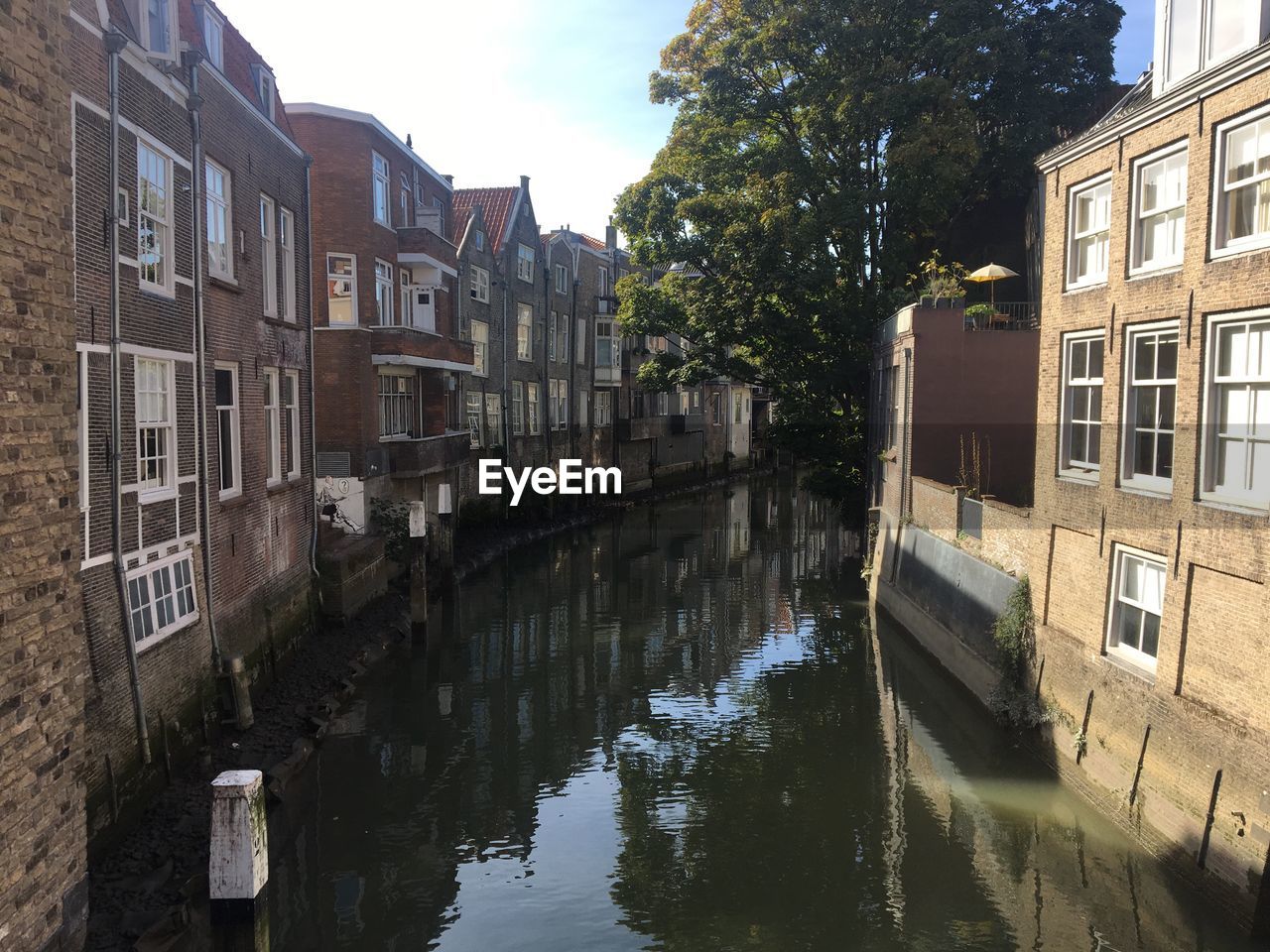 Canal amidst buildings in city