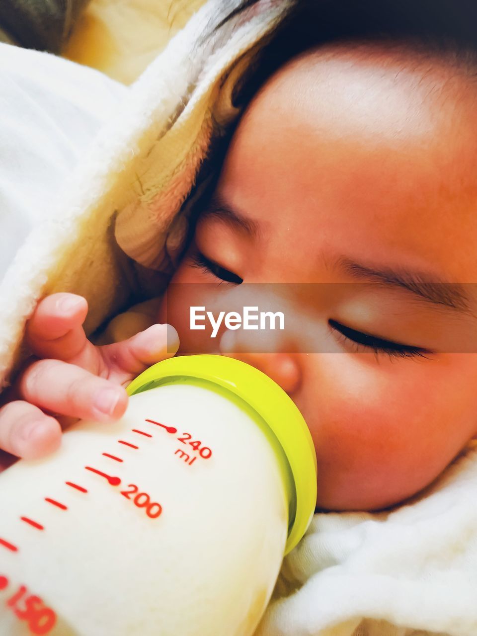 Close-up of baby drinking milk