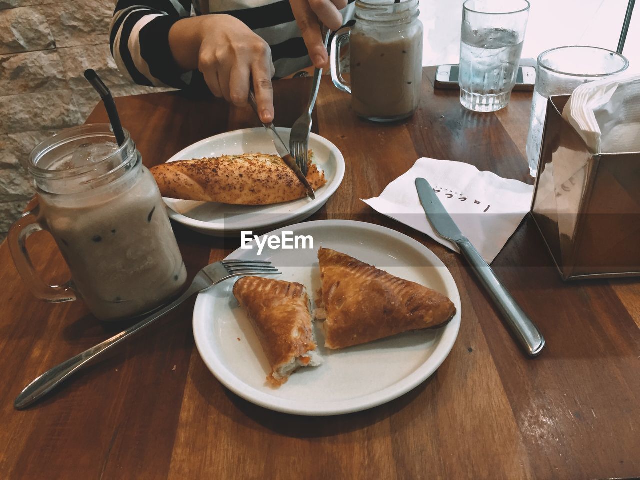 HIGH ANGLE VIEW OF BREAKFAST SERVED ON TABLE IN KITCHEN