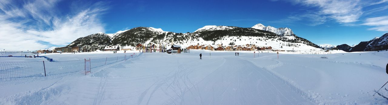 SNOW COVERED MOUNTAIN AGAINST SKY