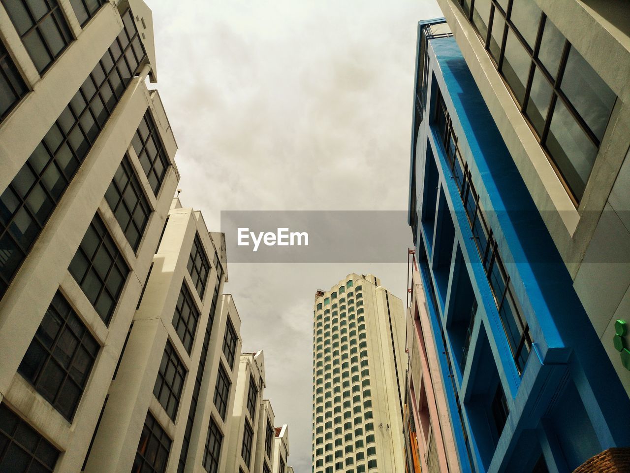 Low angle view of modern buildings against sky