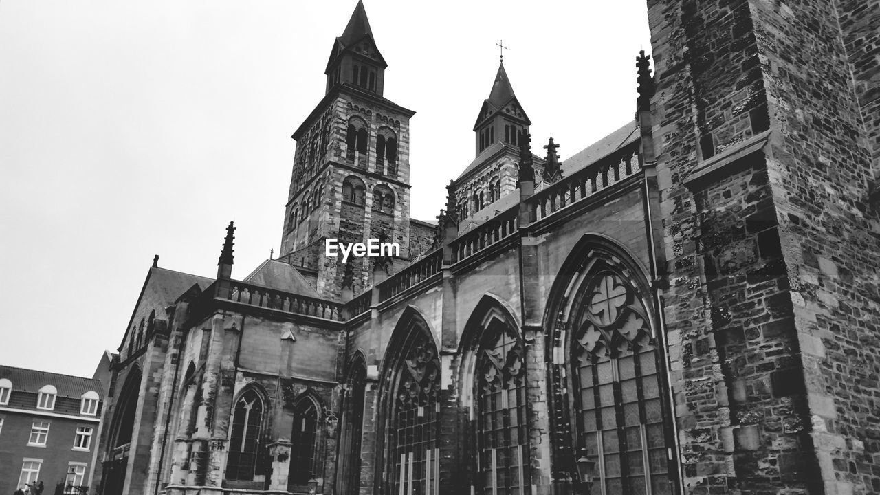 LOW ANGLE VIEW OF CHURCH WITH CHURCH IN BACKGROUND