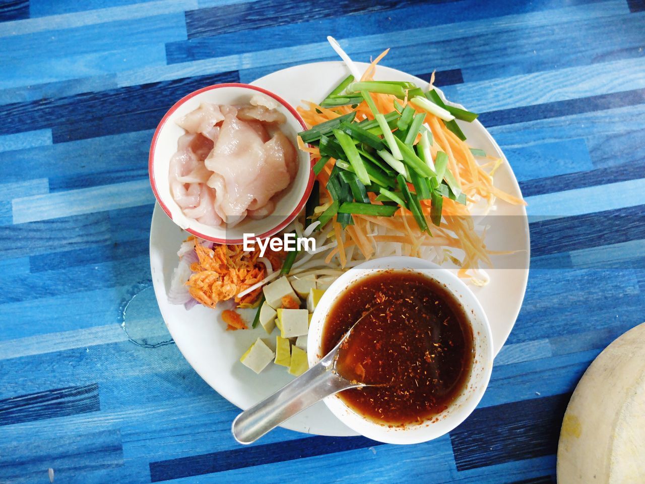 Directly above shot of pad thai served in plate on table