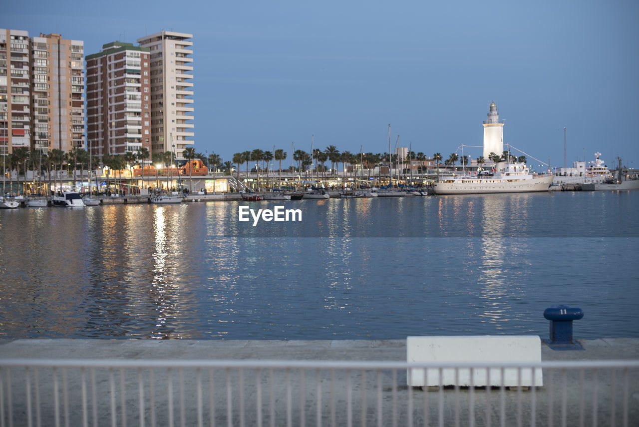 Scenic view of harbor against clear sky