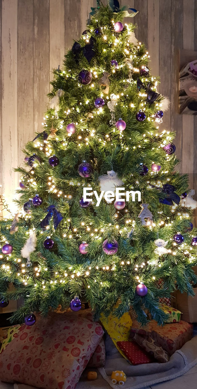 Illuminated christmas tree at home