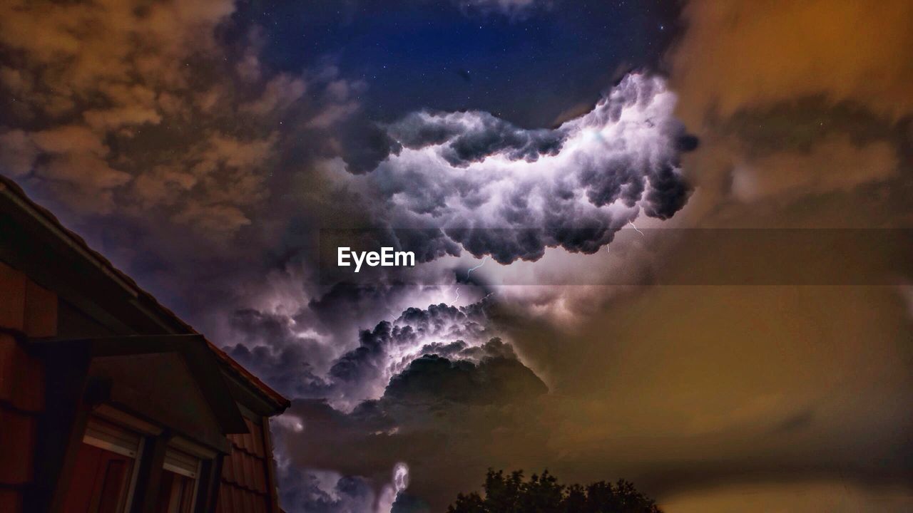 Storm clouds over cloudy sky