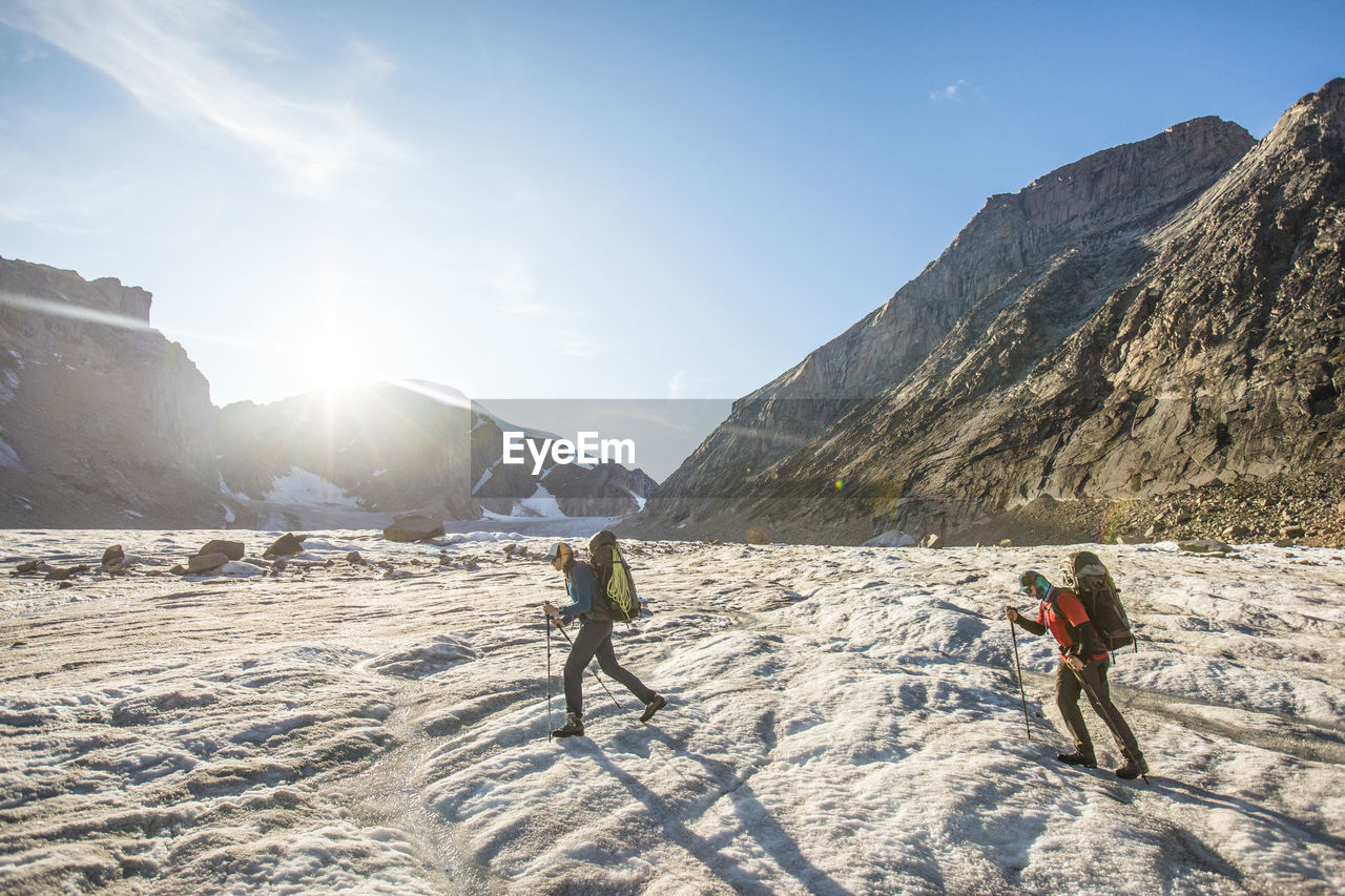 Two climber cross a glacier in auyuittuq national park