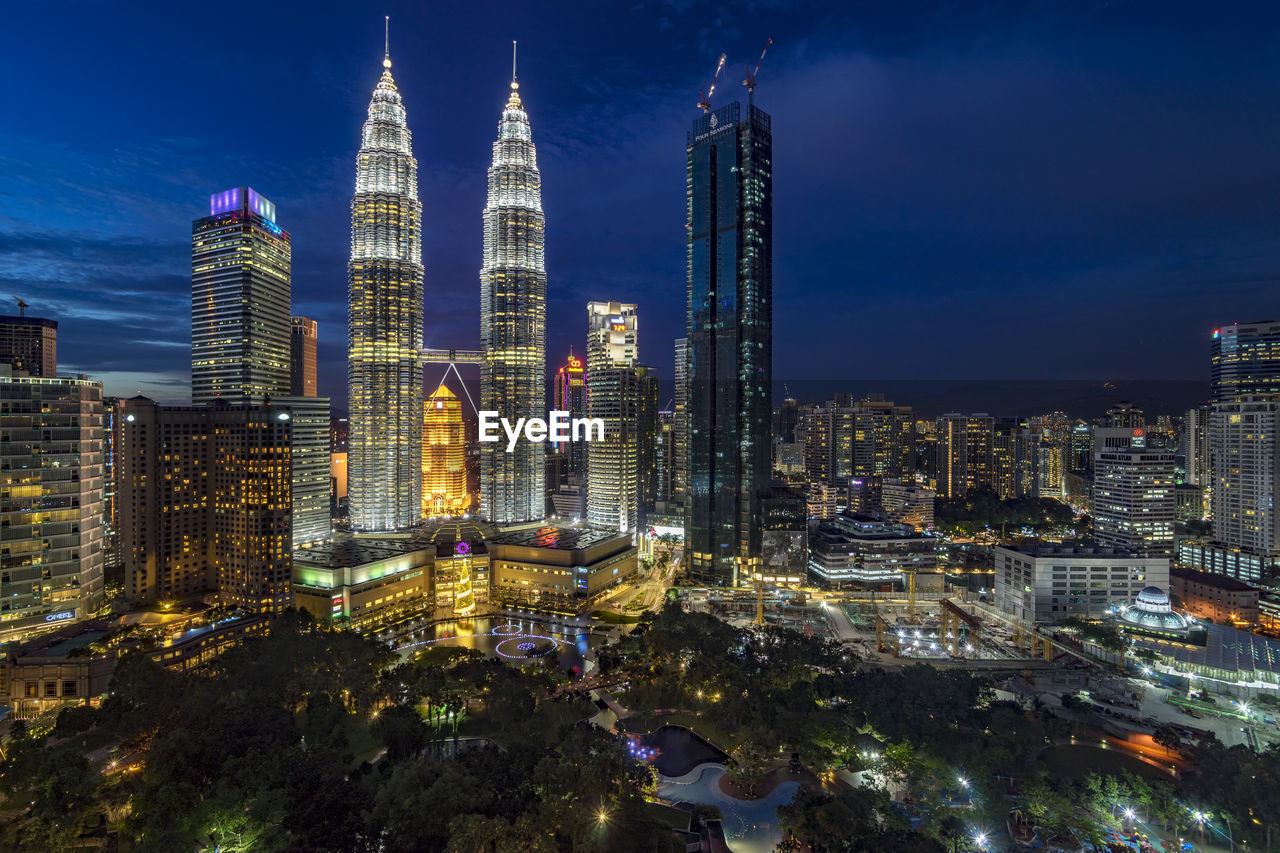 View of skyscrapers lit up at night