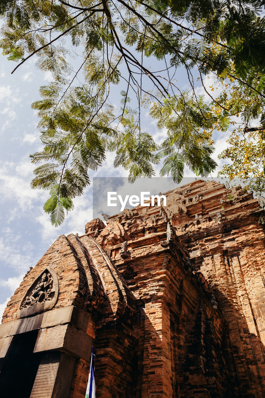 Low angle view of historic temple against sky