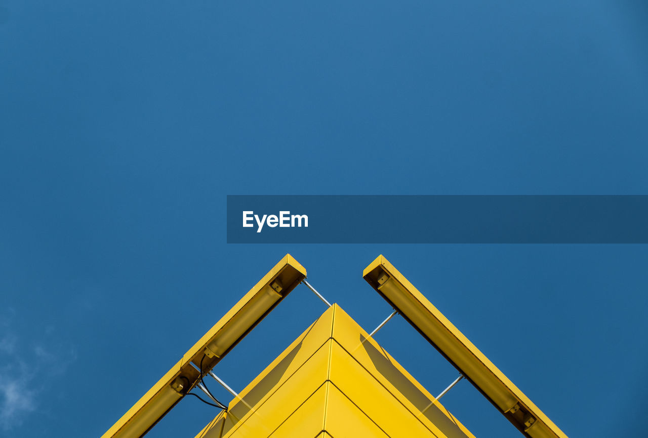 Low angle view of building against blue sky