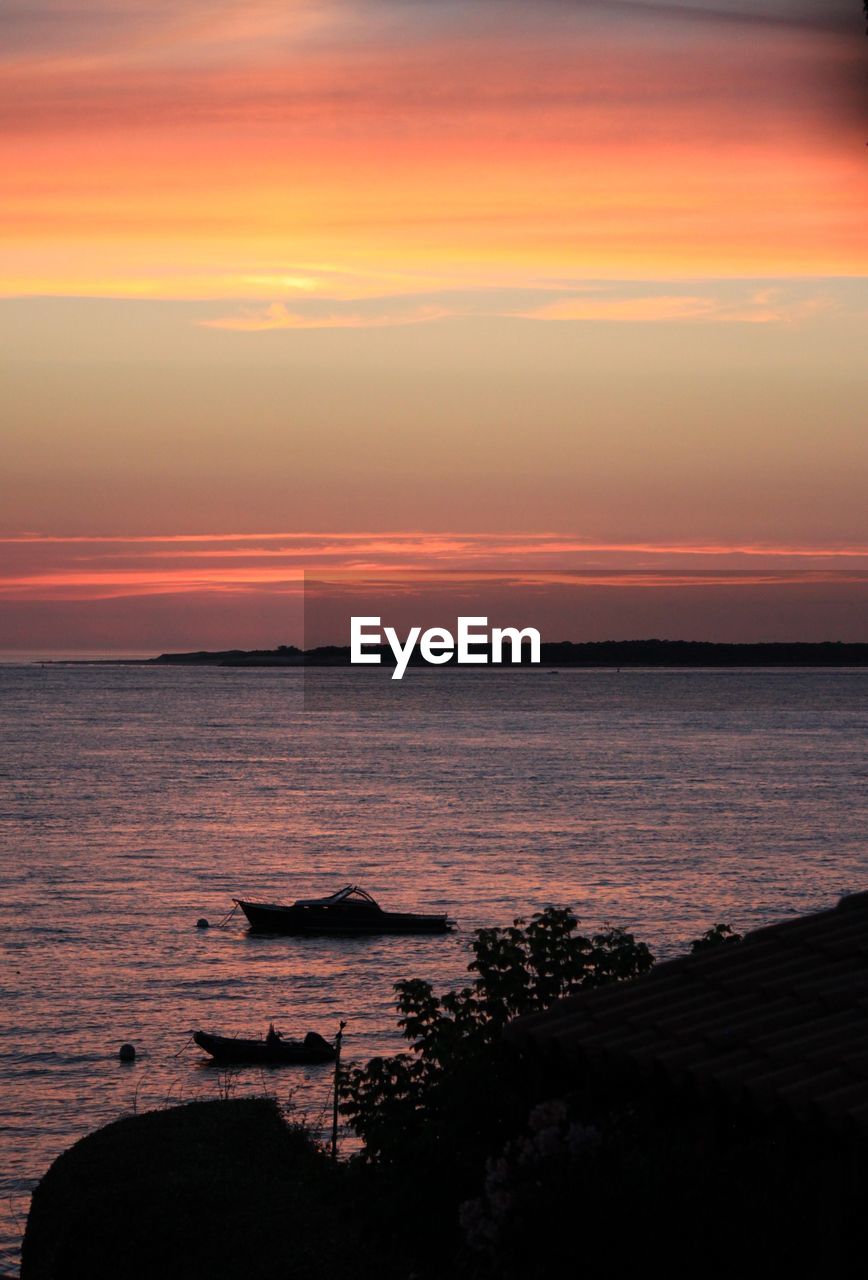 Scenic view of sea against sky at sunset