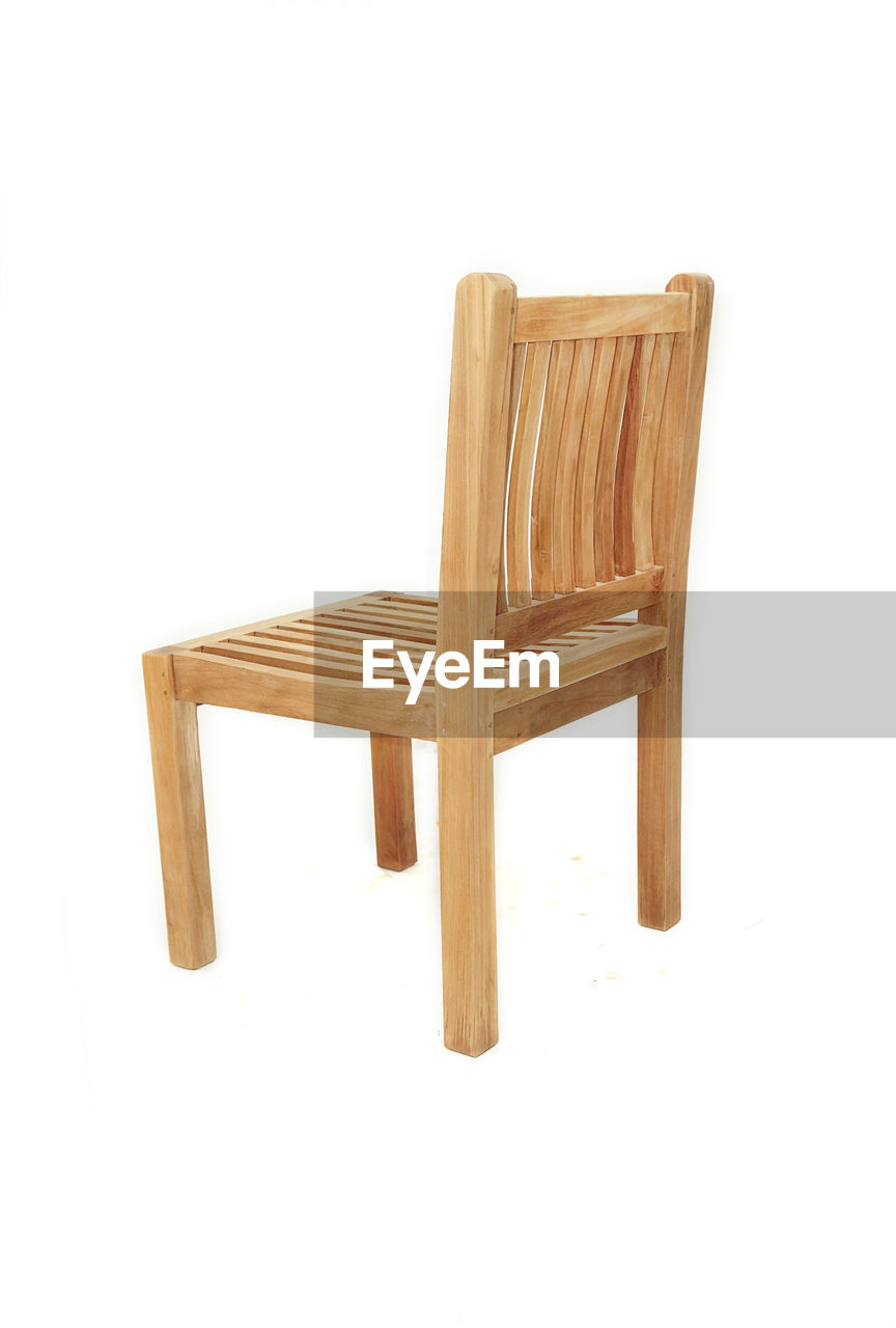 WOODEN CHAIR AGAINST WHITE BACKGROUND