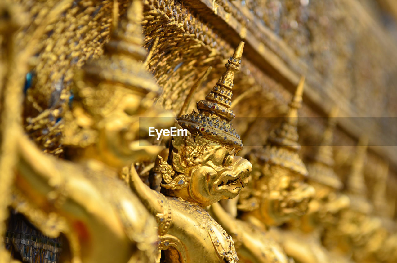 Low angle view of statues at wat phra kaew