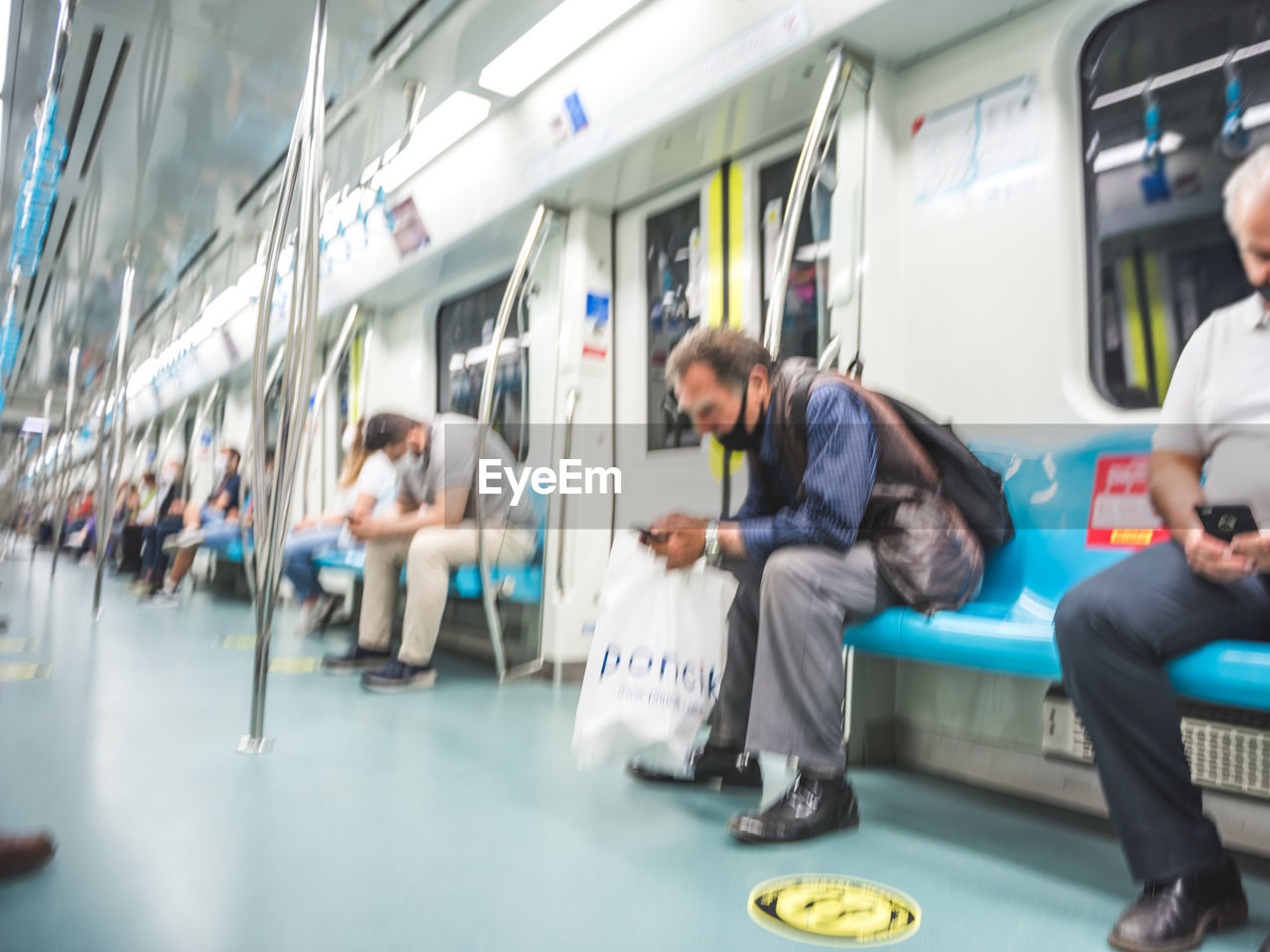 GROUP OF PEOPLE IN TRAIN