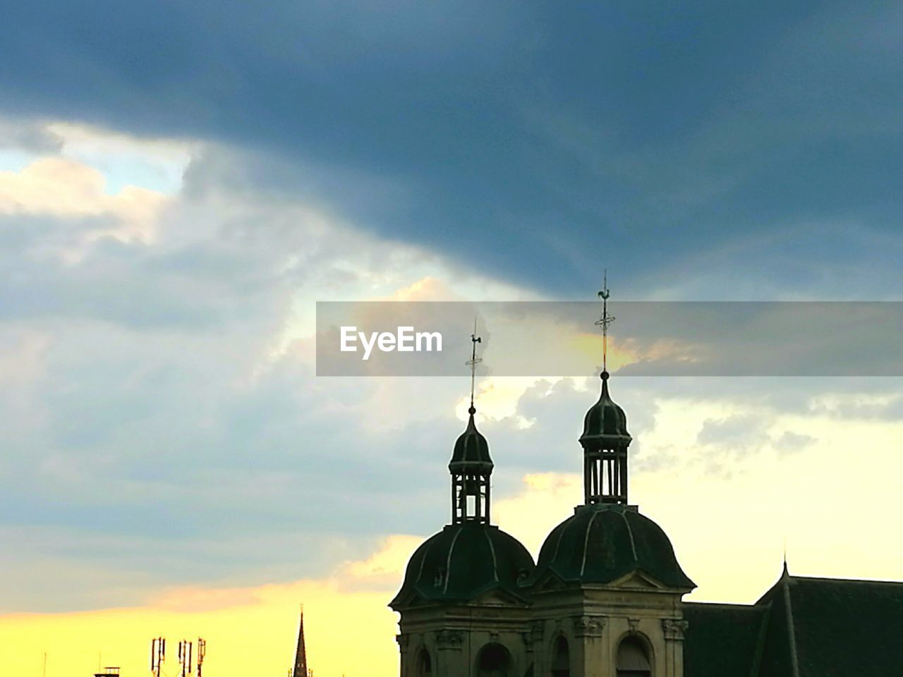 CHURCH AGAINST SKY AT SUNSET