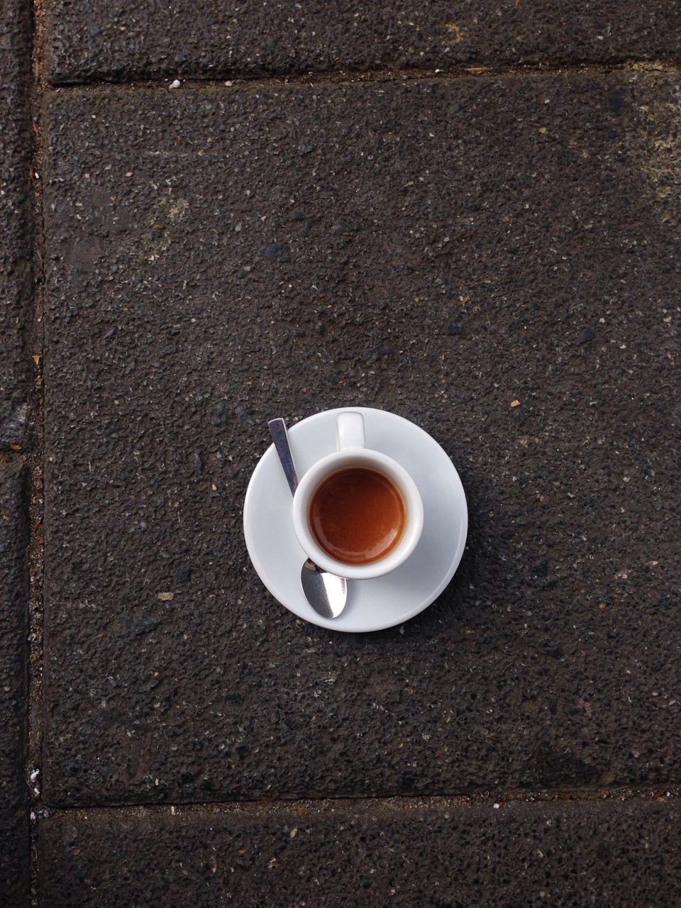 CLOSE-UP OF COFFEE CUP WITH COFFEE CUP