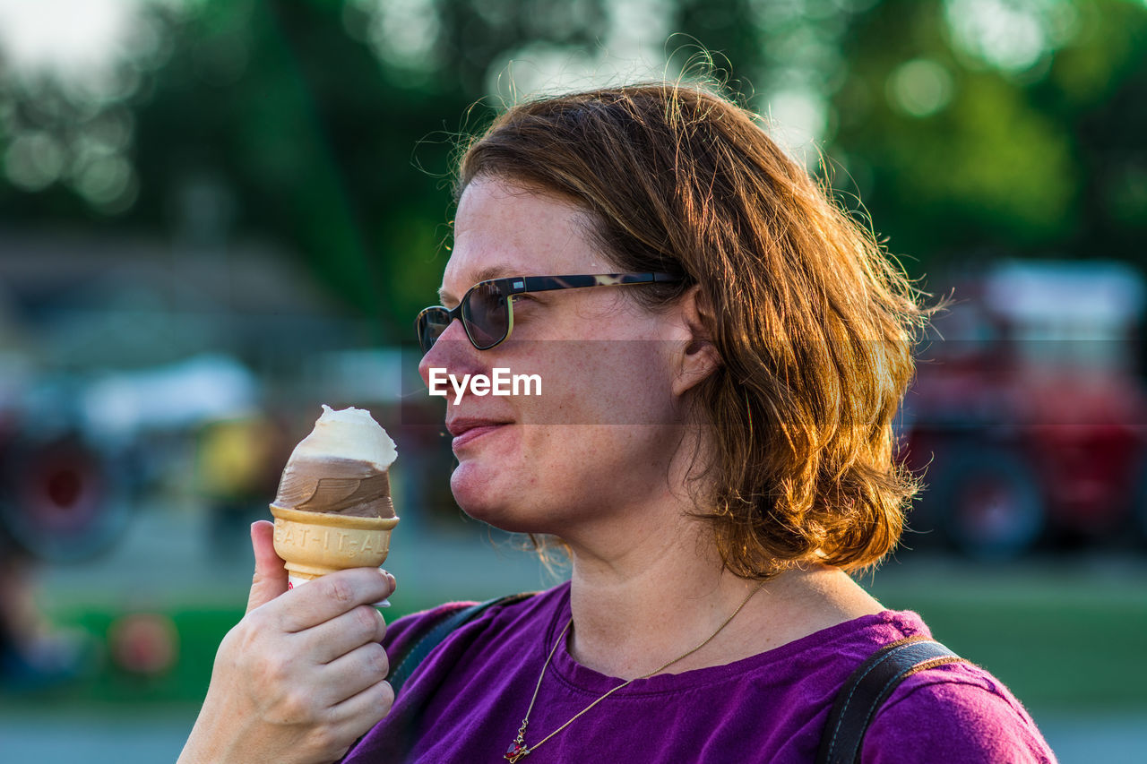 Close-up of woman holding ice cream cone