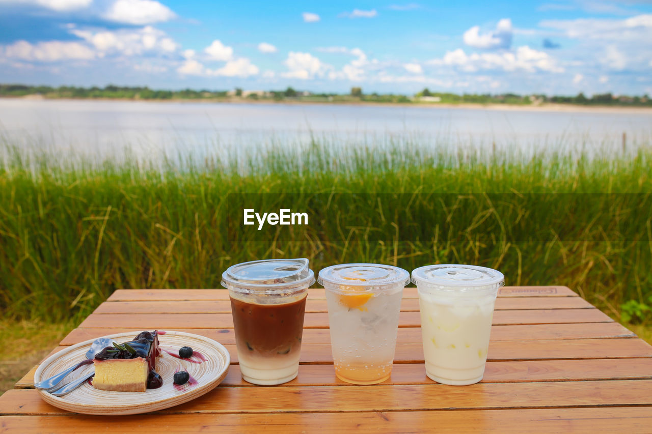 close-up of drink on table against sky