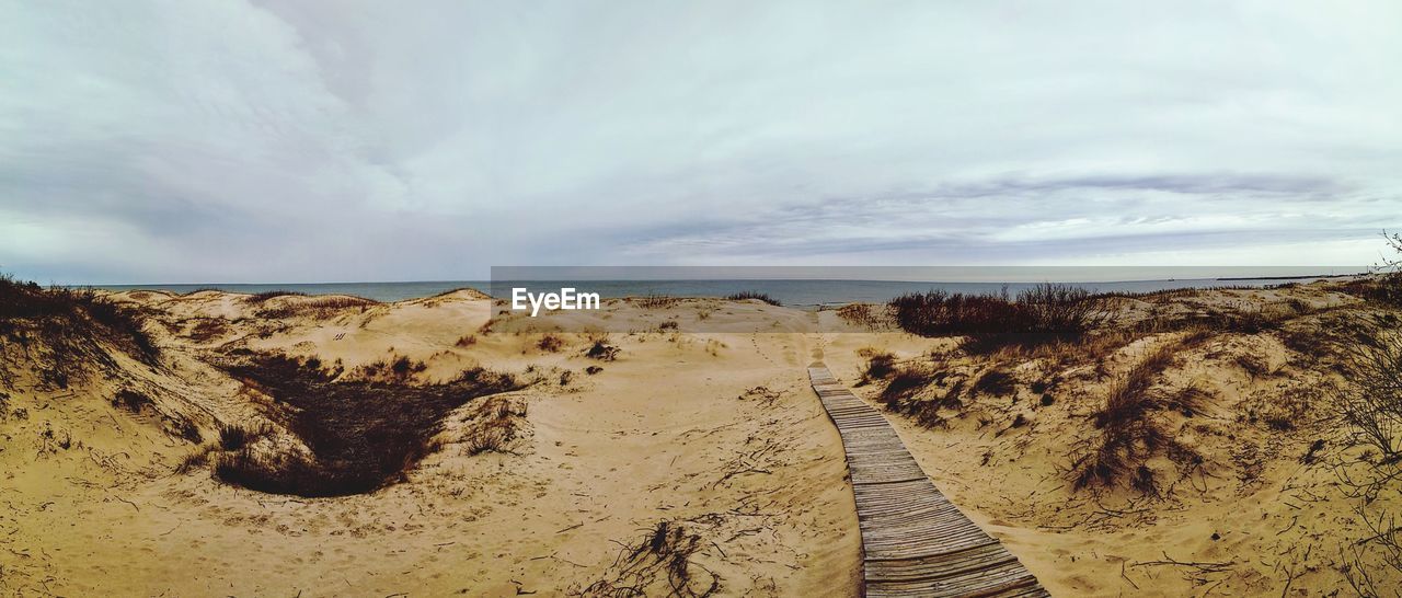 Scenic view of beach against sky