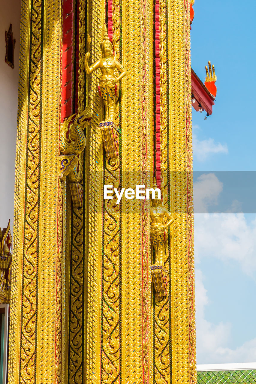 CLOSE-UP OF TEMPLE AGAINST SKY