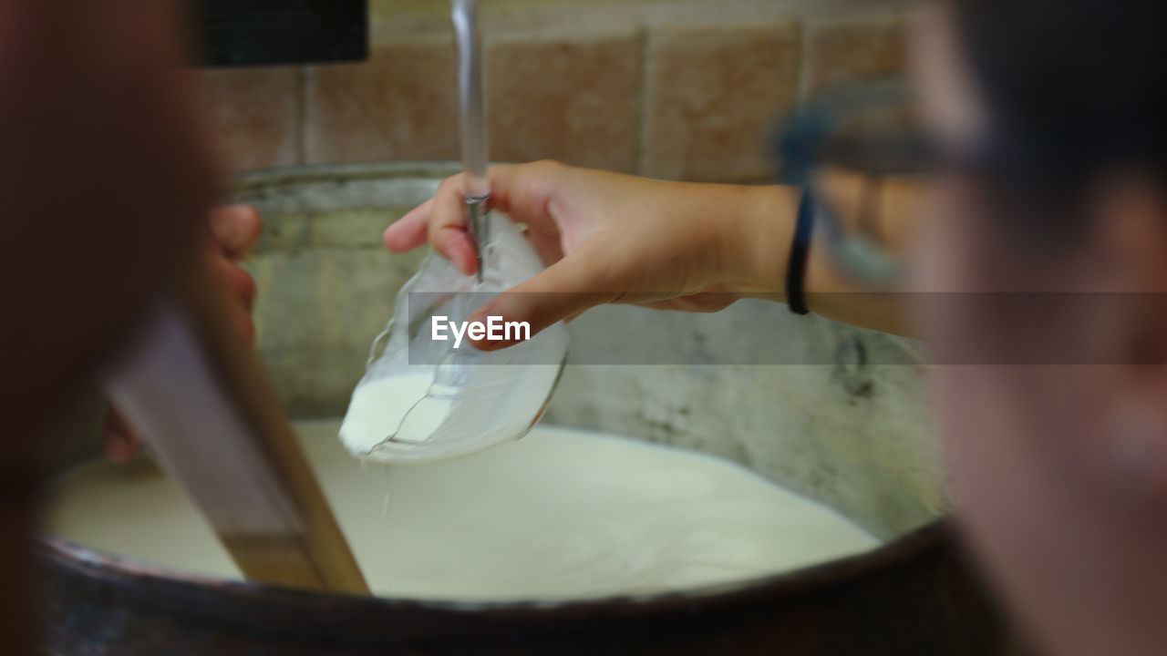 Cropped hands of man preparing food