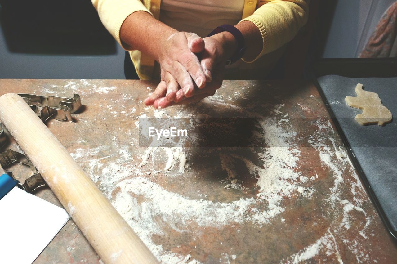 Midsection of person making cookie