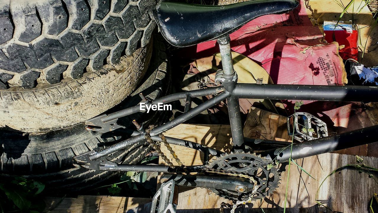 High angle view of tires and old bicycle