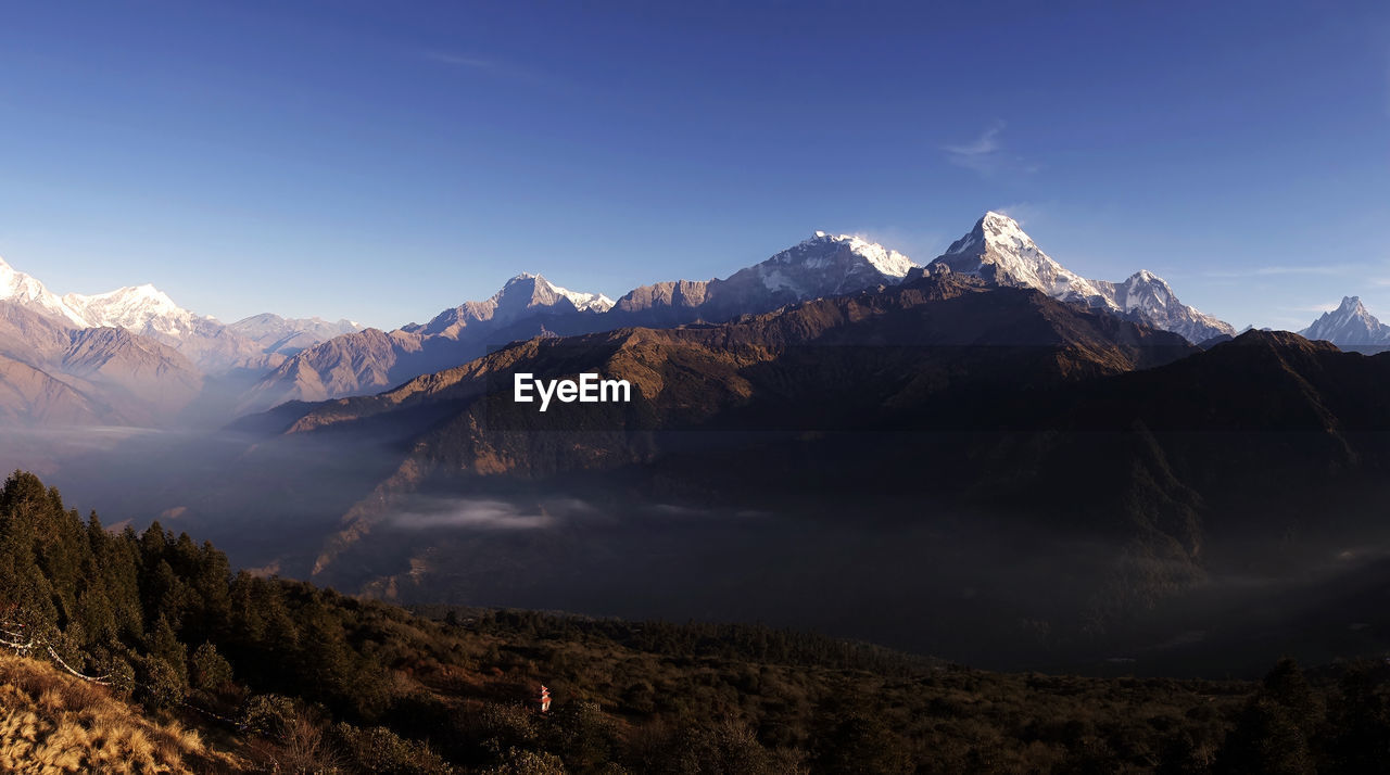 Panorama view of himalayan mountain range during sunrise view from poon hill view point at nepal