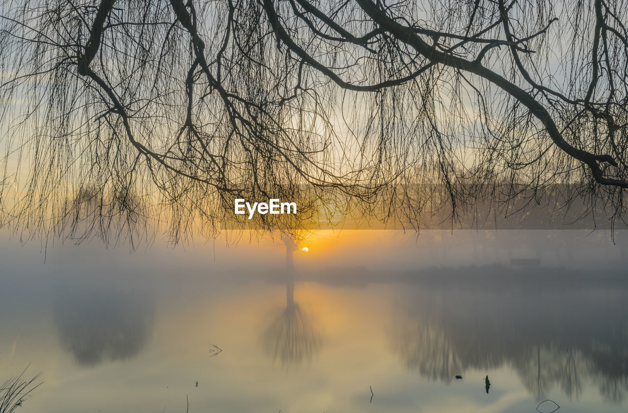 SCENIC VIEW OF LAKE DURING SUNSET