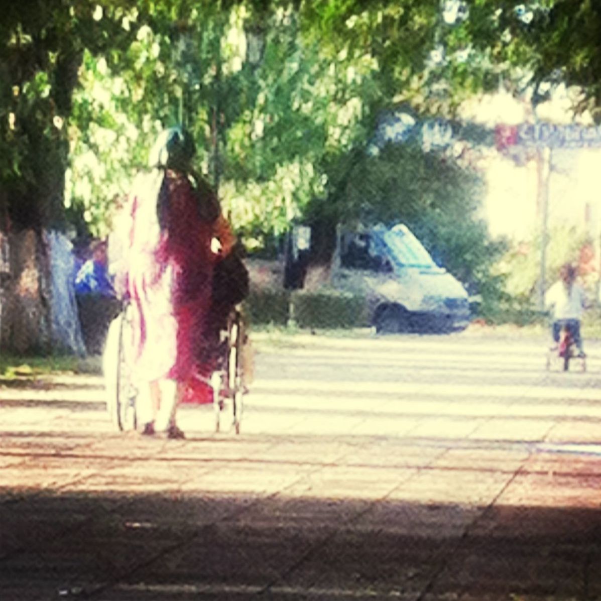 WOMAN STANDING ON TREE TRUNK