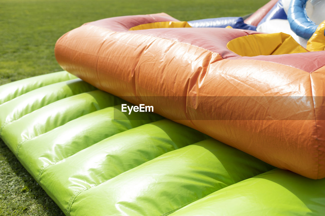 Inflatable construction in amusement park. obstacle course for children. playground in stadium.