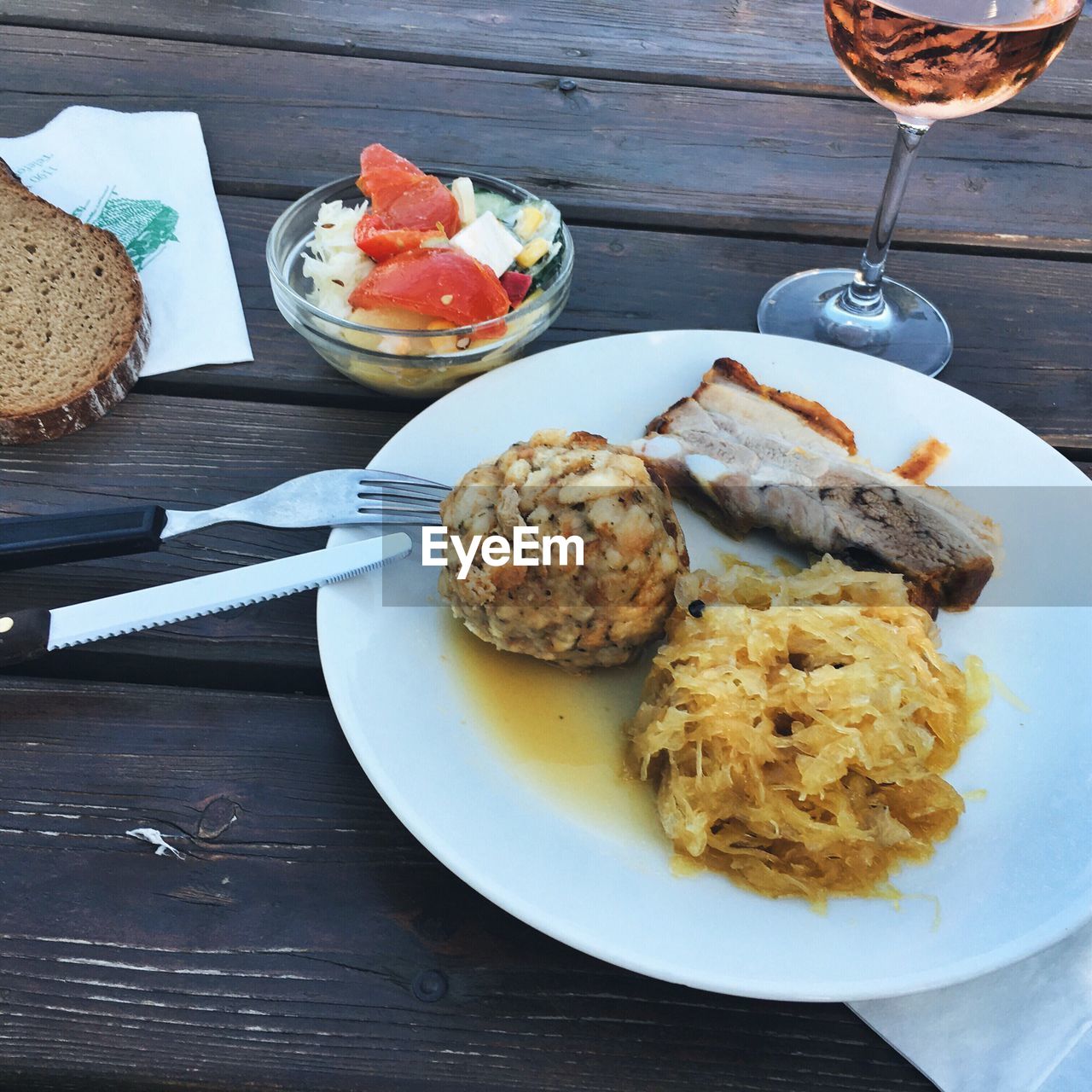 High angle view of food in plate and drink on wooden table