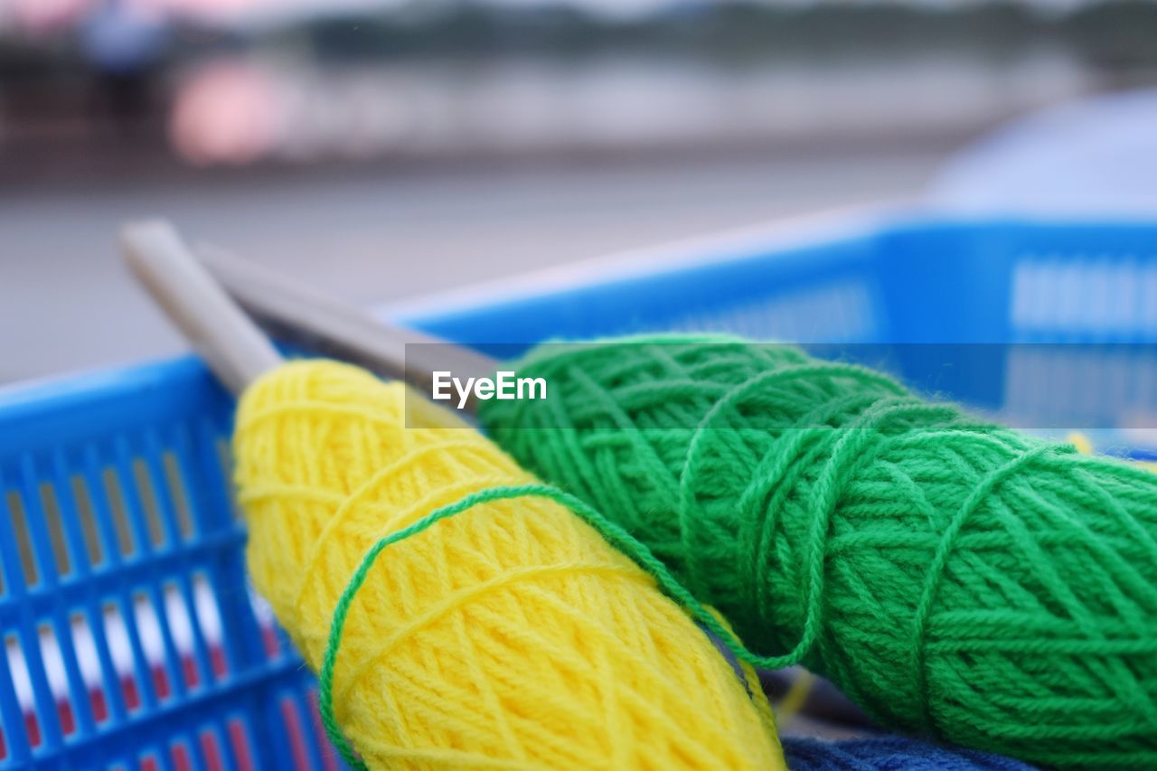 Close-up of wool in basket outdoors