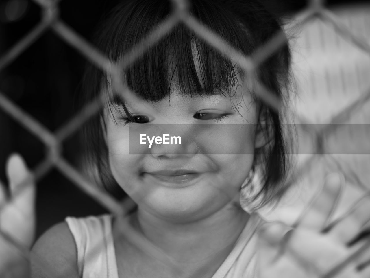 PORTRAIT OF CUTE GIRL SMILING WHILE STANDING OUTDOORS