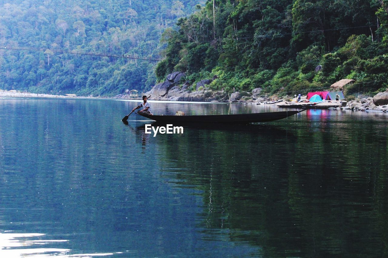 SCENIC VIEW OF BOATS IN WATER