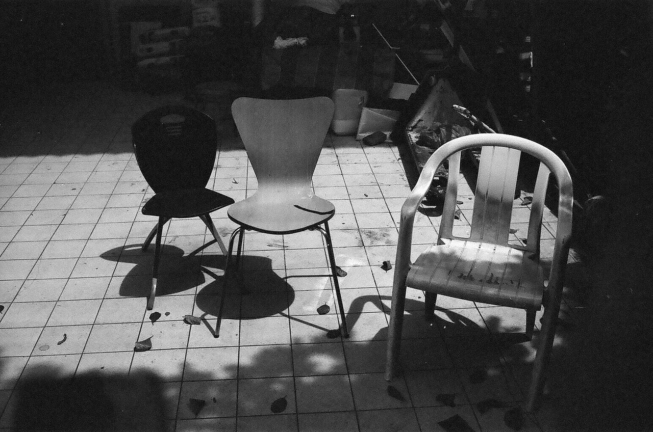 High angle view of empty chairs on floor