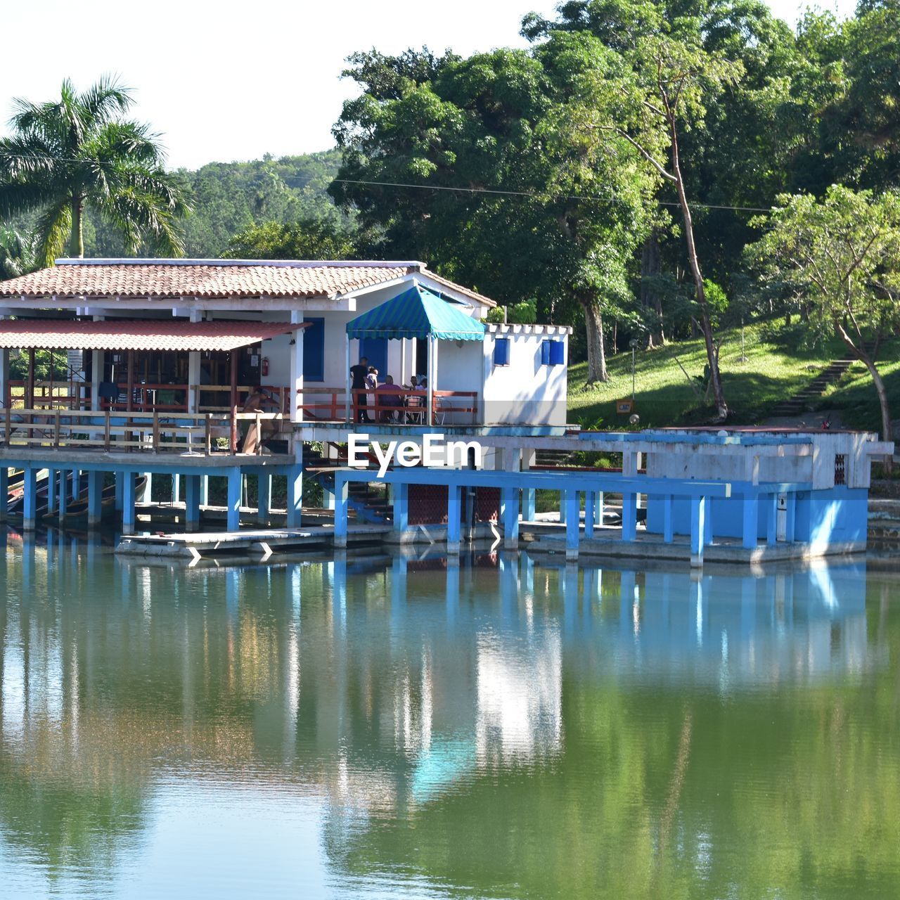 BOATS IN LAKE AGAINST BUILDINGS