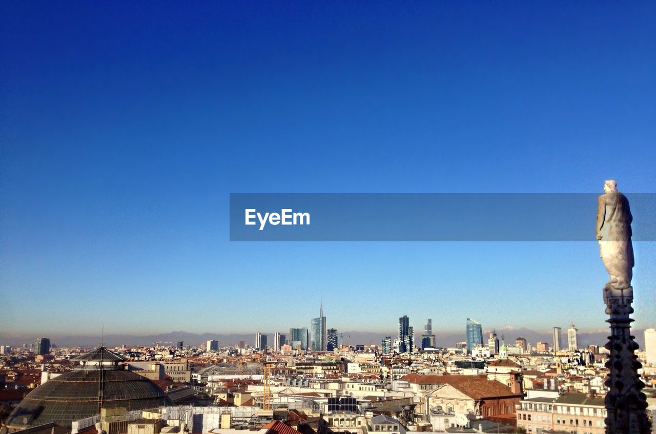 VIEW OF CITYSCAPE AGAINST CLEAR SKY