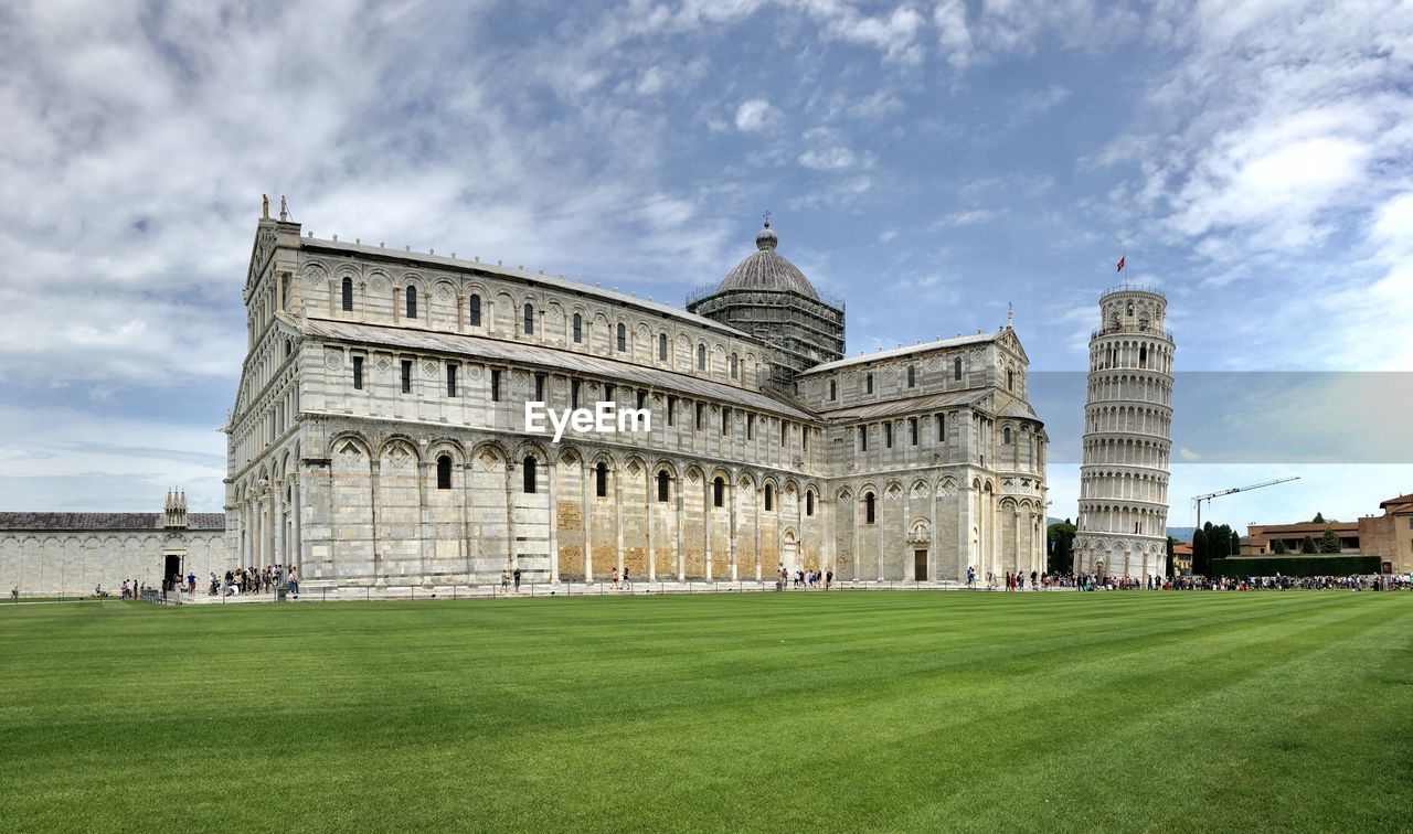 Pisa cathedral by lawn in city