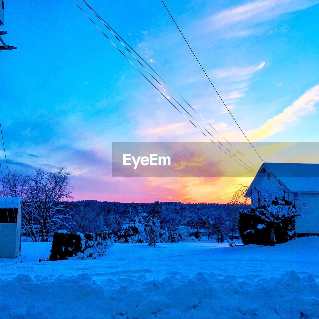 SNOW COVERED LANDSCAPE AT DUSK