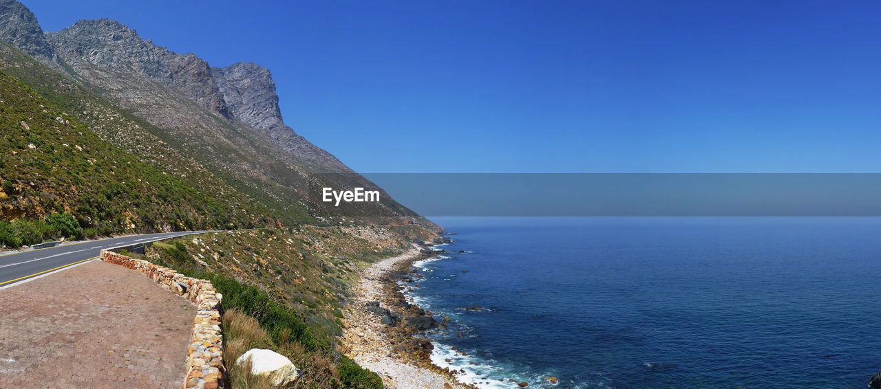 Scenic view of sea against blue sky